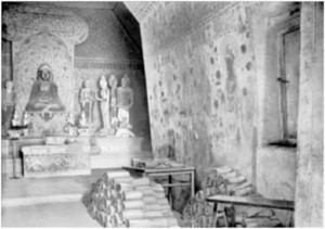 Figure 2. Cave 16 in Dunhuang, with scrolls removed from the library cave piled up outside the door