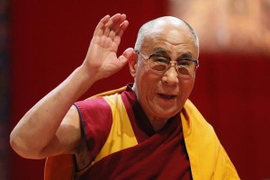 Tibet's exiled spiritual leader the Dalai Lama waves to the audience after his first speech during the European Tibetan Buddhist Conference in Fribourg